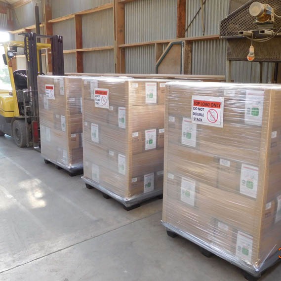 a forklift with pallets of barley leaf